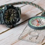 A navigation compass next to an outdoor watch from G-Shock that also includes navigation integration.