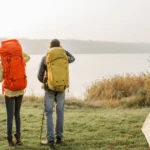 Group of travellers on a camping and hiking trip using different types of hiking backpacks.