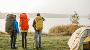 Group of travellers on a camping and hiking trip using different types of hiking backpacks.