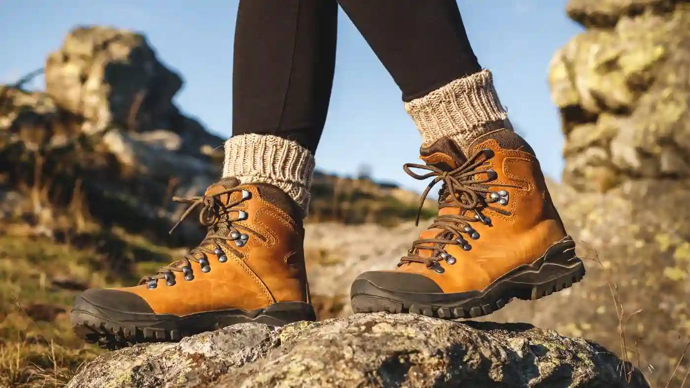 Wearing hiking socks with proper trekking and outdoor footwear while hiking and trekking.