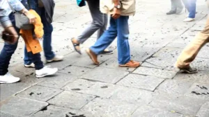 Different types of shoes that tourists and locals wear while walking the streets of Rome, Italy.