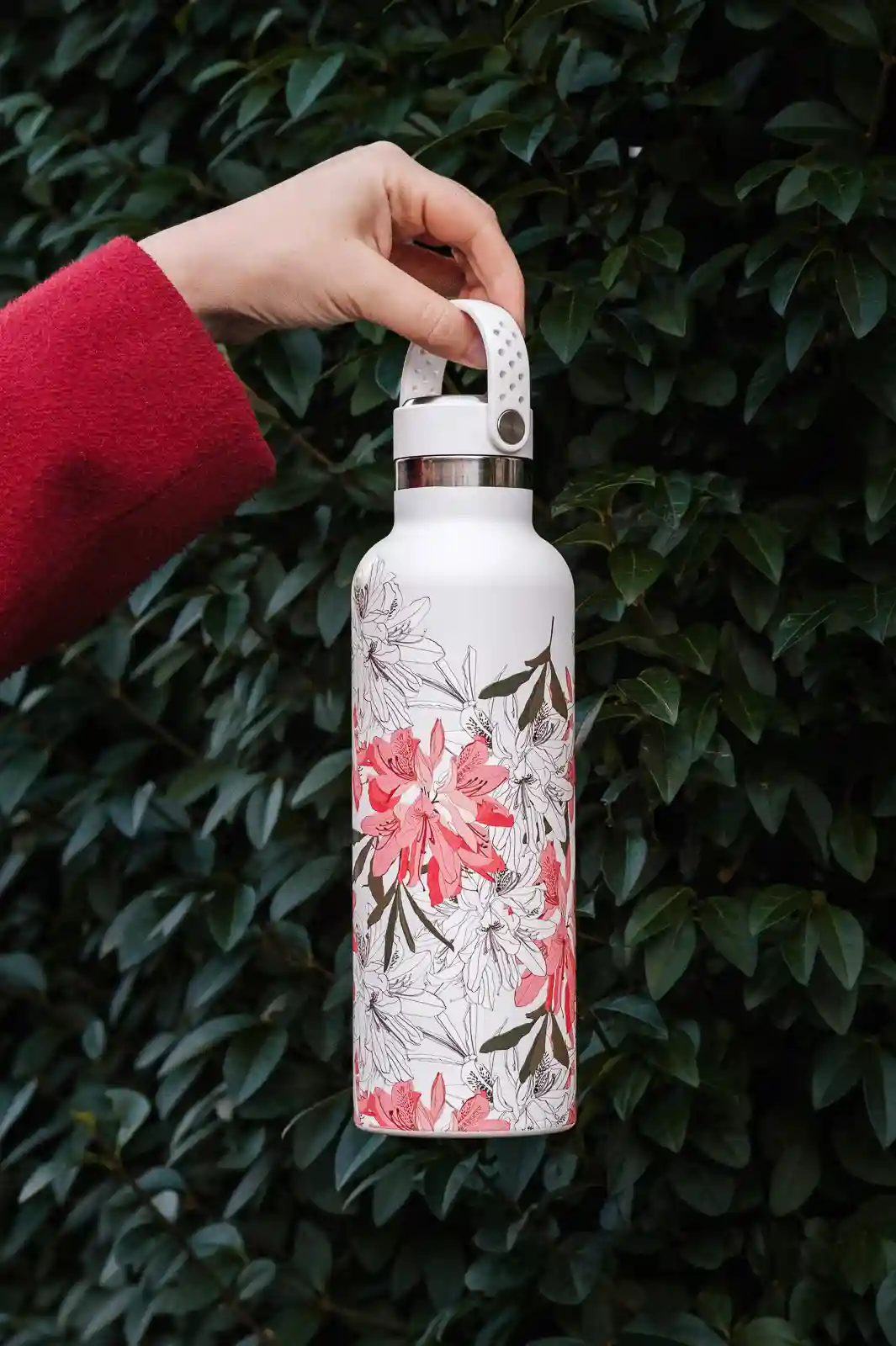 A white Super Sparrow with white and pink flowers printed on it.