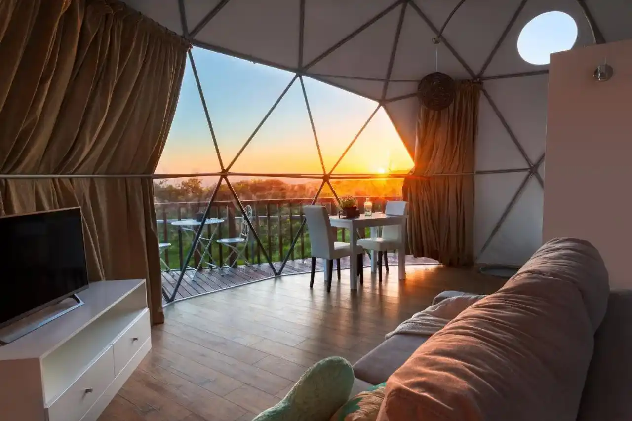 Sunrise seen from the interior of a glamping tent at Soul Glamping in Madeira, Portugal. 