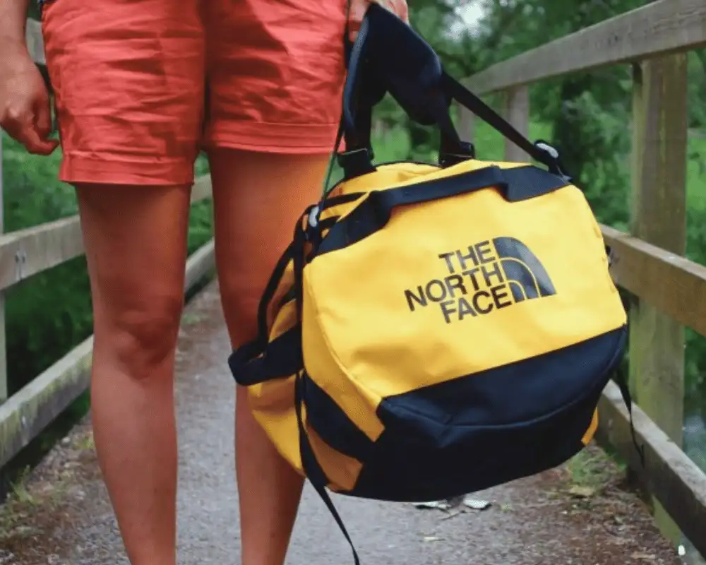 The North Face Base Camp Duffel in yellow and black.