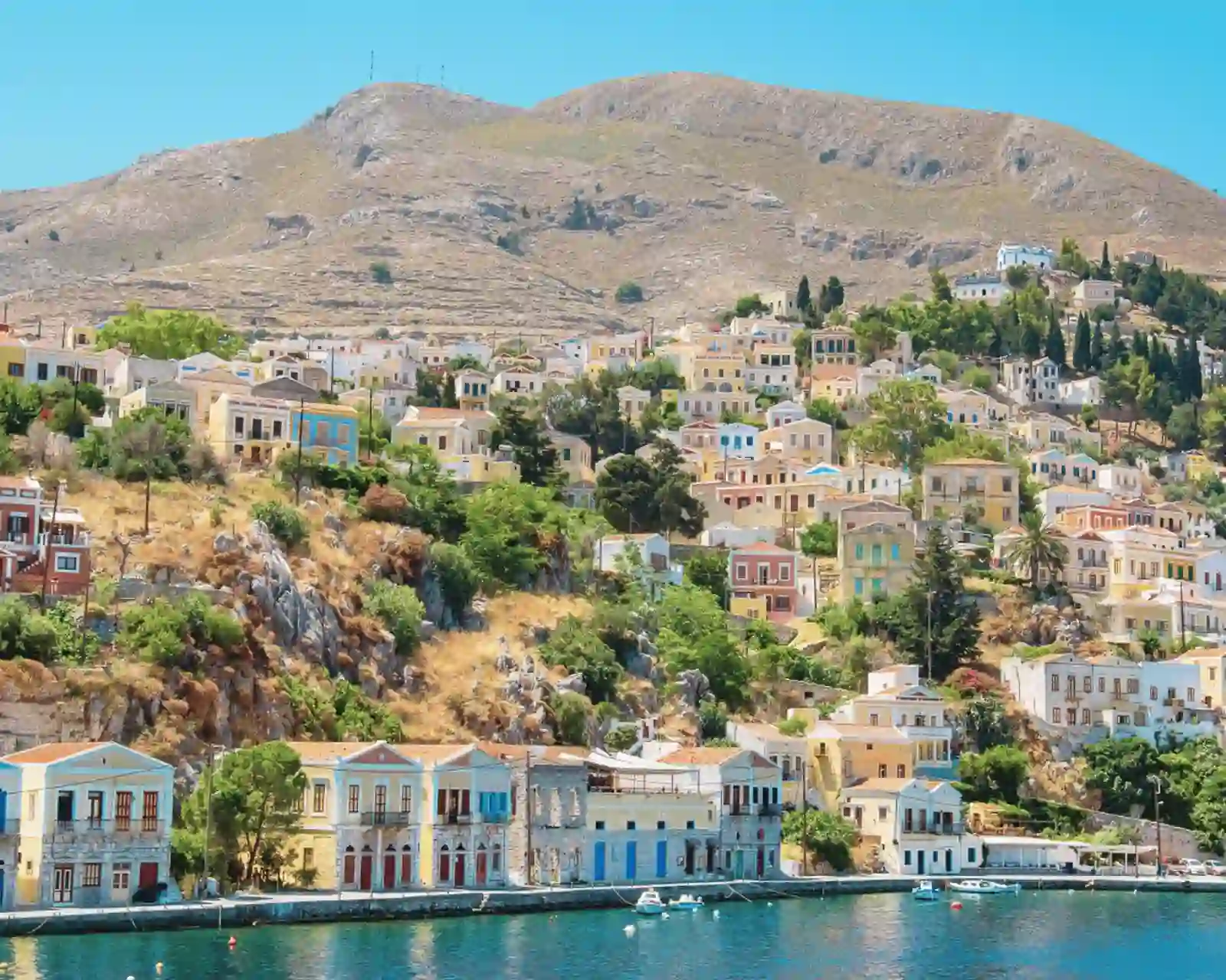 Colourful houses by the sea at Symi island in Greece.