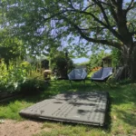 Overview of the Elegear sleeping pad inflated and being used outdoors.