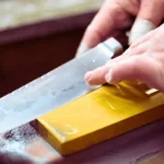 Knife sharpening techniques for beginners using a sharpening stone.