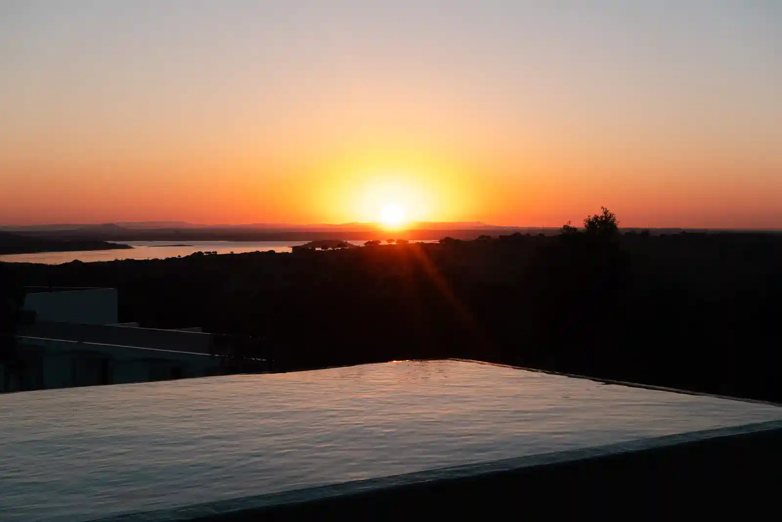 Sunrise views from the infinity TimeScape Pool from Montimerso Skyscape Country House hotel in Alentejo, Portugal.