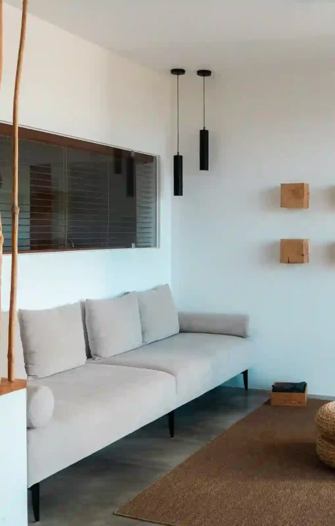 Sofa and living area inside the hotel room at the Montimerso hotel in Alentejo, Portugal.