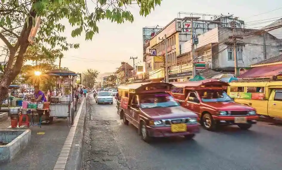 Traditional songthaews, a type of public transportation in northern Thailand and common in the city of Chiang Mai.