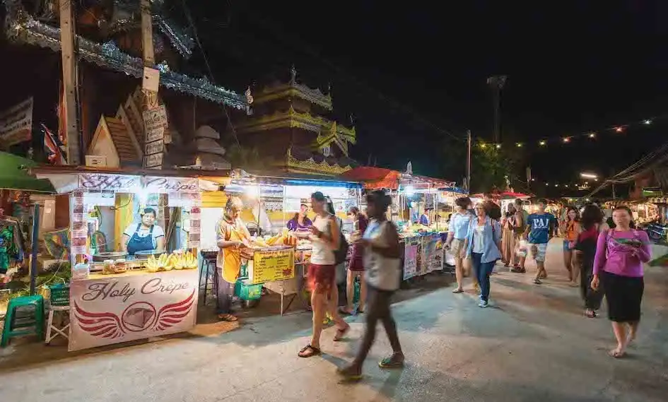 Vendors at the Sunday weekly market in Chiang Mai, Thailand.