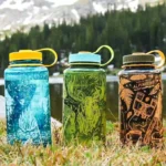 Nalgene sustainable water bottles being used outdoors.