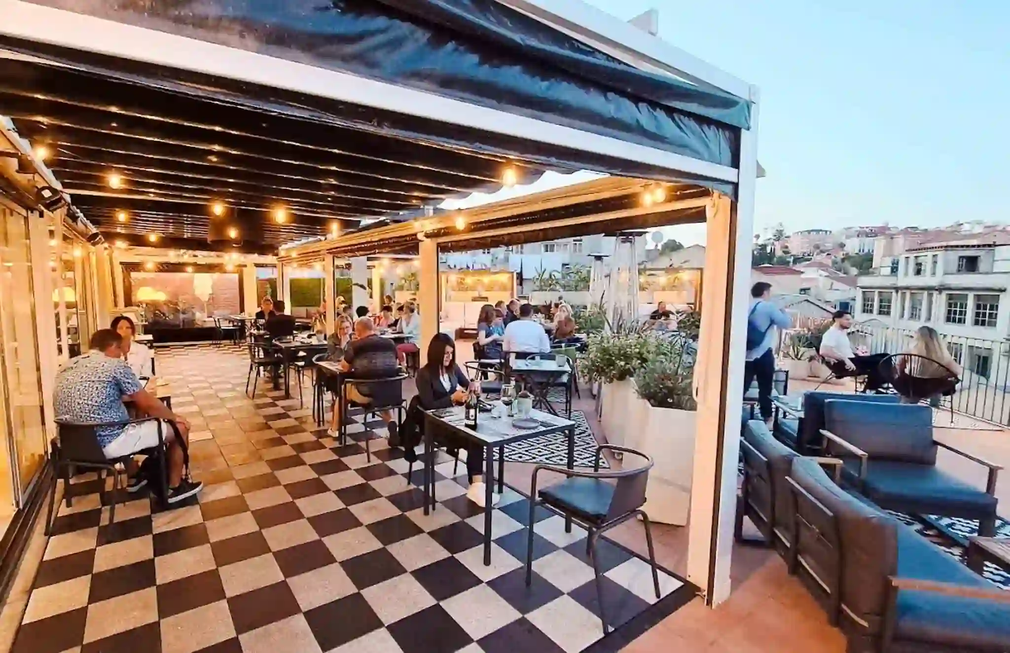 The checkered-floor terrace of the Art Inn rooftop bar in Lisbon, Portugal. 