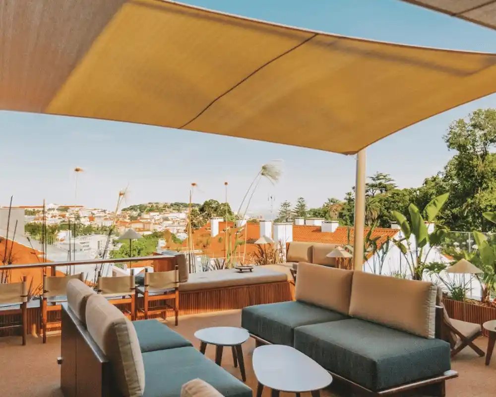 The terrace of the V Rooftop Bar with a view of Lisbon, Portugal, one of the many rooftop bars and restaurants in Lisbon.