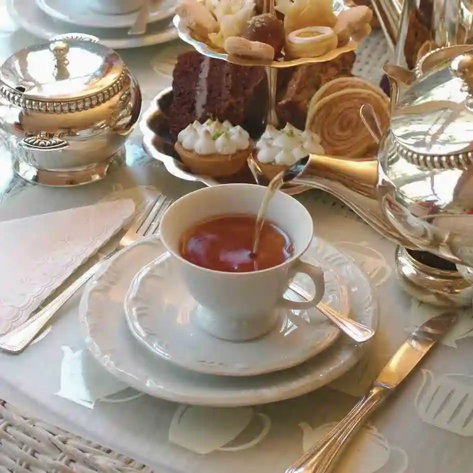 A traditional British afternoon tea with pastries.