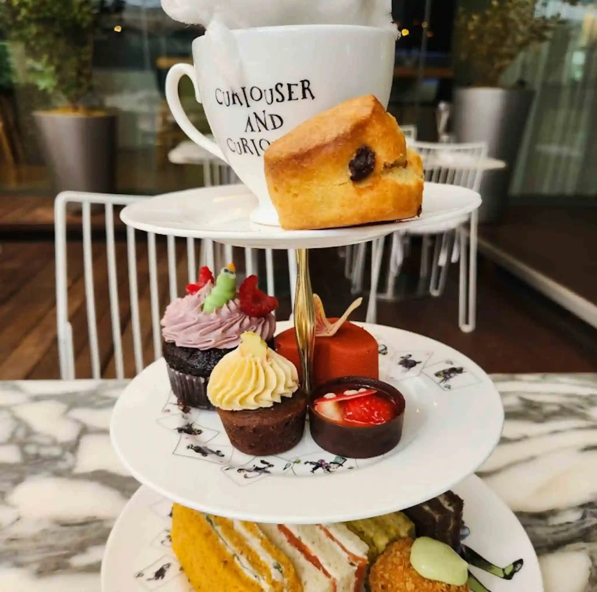 Classic afternoon tea pastries at the Mad Hatters Café and Tea shop in London, UK.