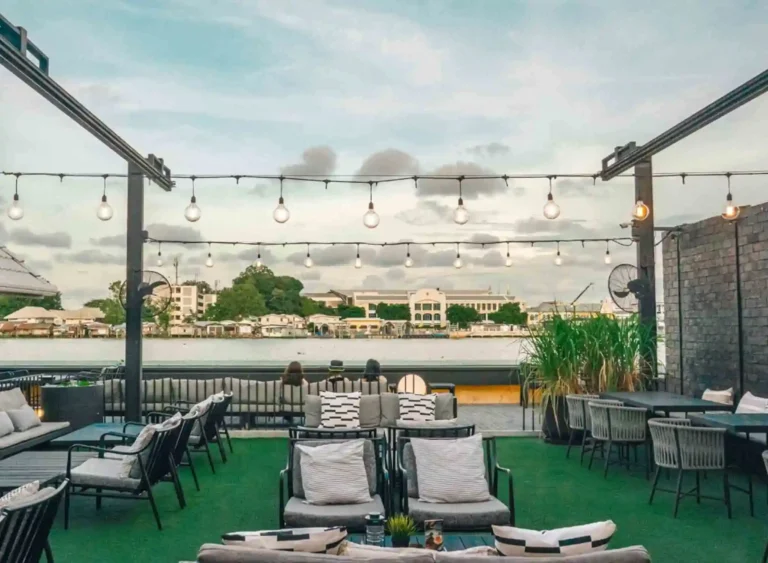 View of the patio of the Theatre Residence Hotel and the Chao Phraya River in Bangkok, Thailand.