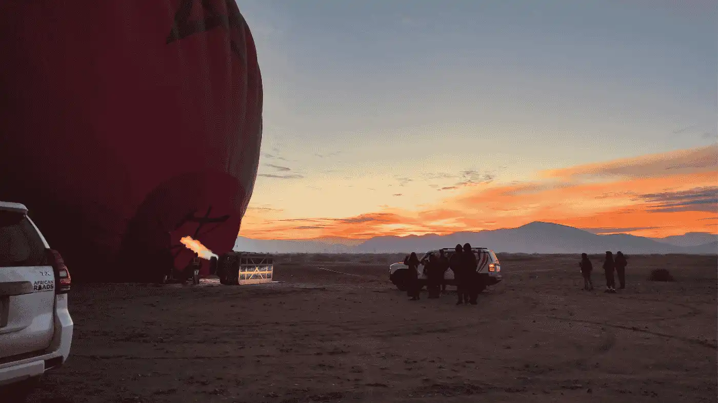 A hot air ballon preparing for take off at sunrise, Marrakech, Morocco