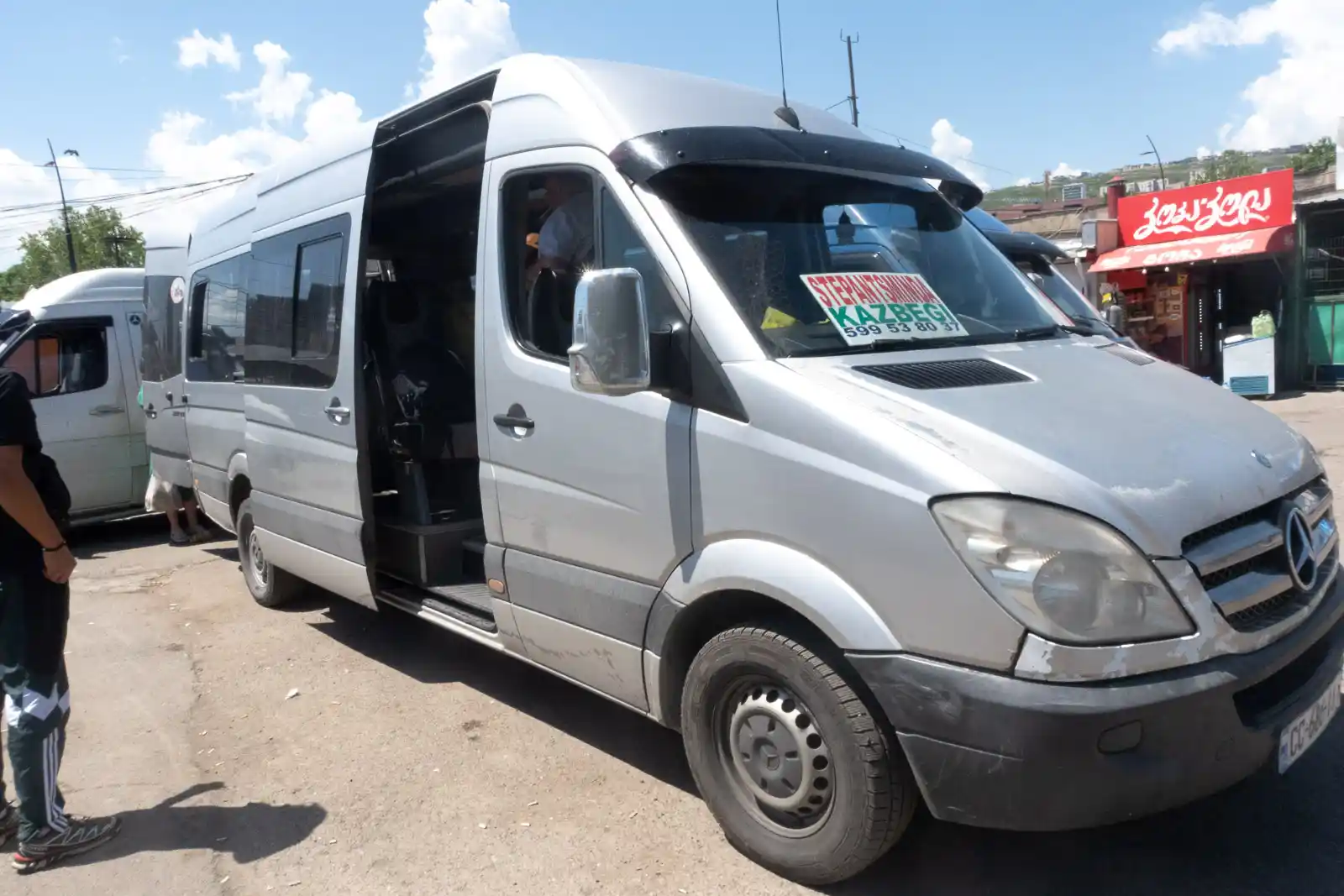 The official public transport, also known as marshrutkas, in Georgia with the destination visible on the windshield.