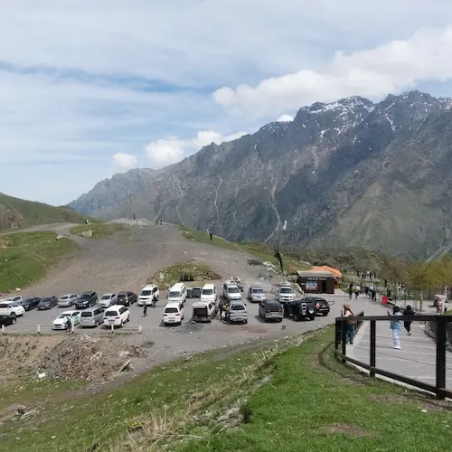A view of the parking lot near the Gergeti Trinity church, Stepantsminda, Georgia.
