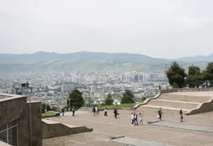 Views of the city of Tbilisi seen from the top of the steps at the Chronicles of Georgia historical landmark.